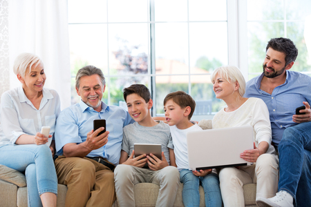 Family having fun with technologyの写真素材