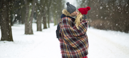 Couple in love in winter sceneryの写真素材