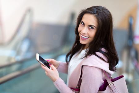 Woman on escalatorの写真素材