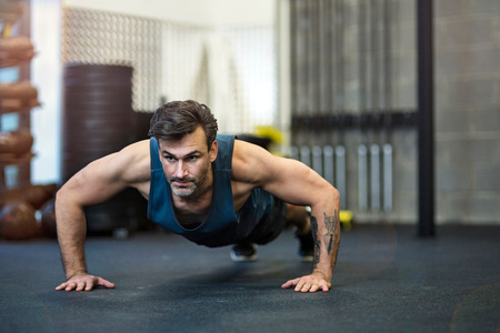 Man working out in gymの写真素材