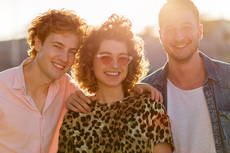 Young woman with two male friends