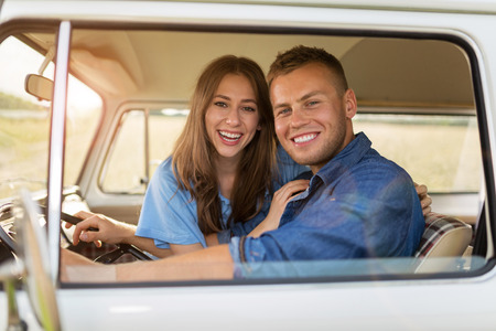 Young couple out roadtripping in their mini vanの写真素材