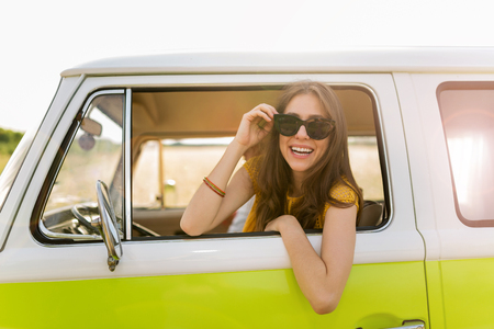 Young woman enjoying a roadtripの写真素材