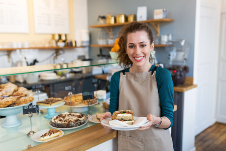 Woman working in coffee shopの写真素材