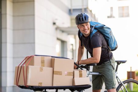 Bike courier making a deliveryの写真素材