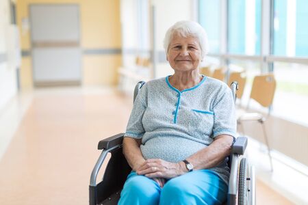 Portrait of an elderly woman sitting in her wheelchairの写真素材