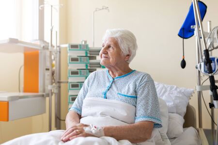 Senior patient in hospital bedの写真素材