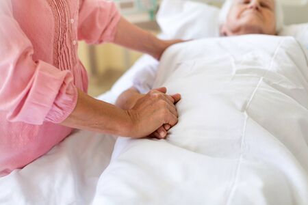 Senior patient and nurse in hospitalの写真素材