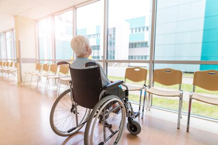 Portrait of an elderly woman sitting in her wheelchairの写真素材