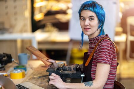 Young craftswoman during her work