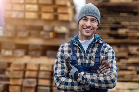 Young male worker in timber warehouseの写真素材