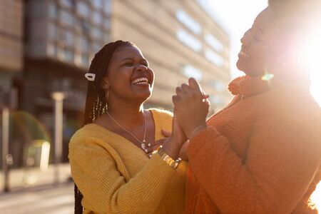 Two beautiful Afro american women having fun together in the city