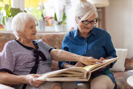 Granny showing her daughter memories from past