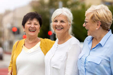 Senior female friends having good time togetherの写真素材