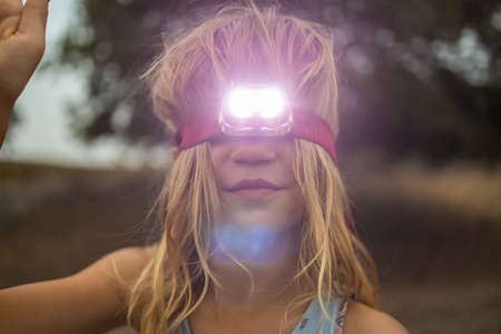 Girl with Head Torch Outdoorsの写真素材