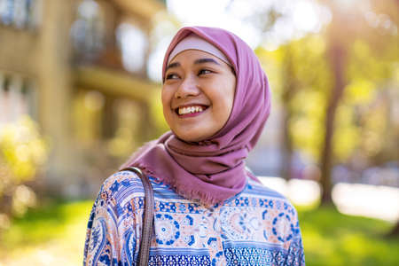Portrait of confident young woman wearing hijab outdoorsの写真素材