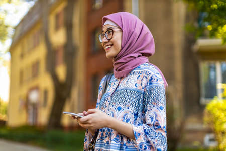 Portrait of confident young woman wearing hijab outdoorsの写真素材