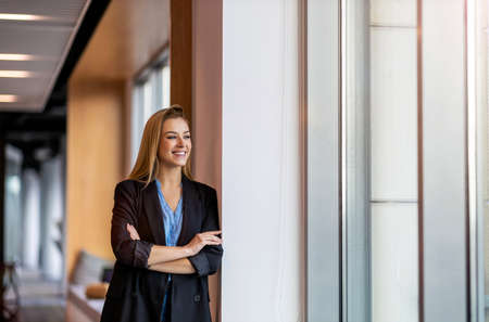 Portrait of an young businesswoman in a modern officeの写真素材