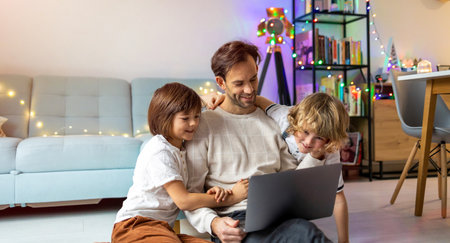 Young man working from home with his little son as a company