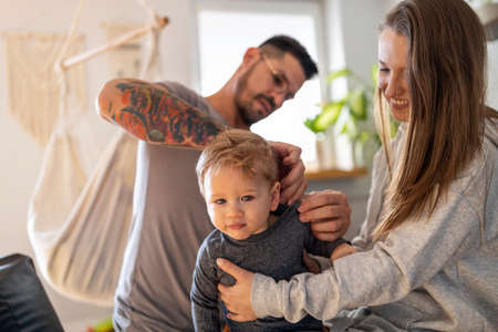 Young family having fun together at homeの写真素材