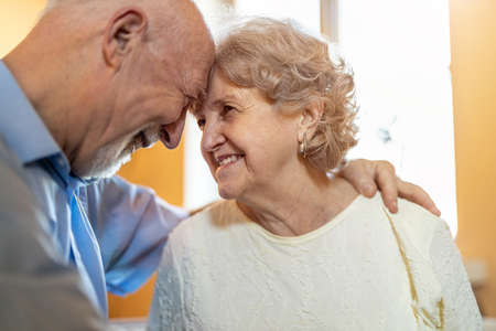 Happy senior couple together at home