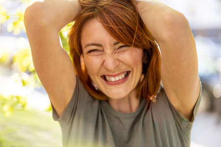 Portrait of a beautiful happy woman outdoorsの写真素材