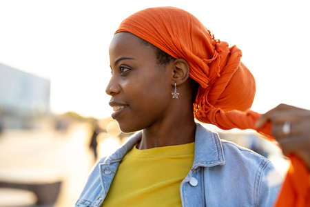 Portrait of smiling young woman in the cityの写真素材