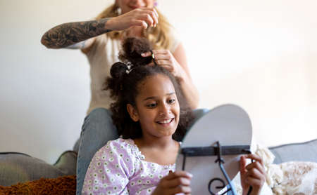 Mom and Daughter Doing Hair