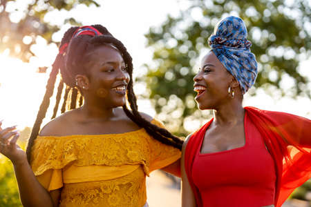 Two girlfriends having fun outdoorsの写真素材