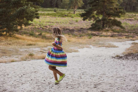 Little girl dancing in nature, Drents-Friese Wold, Netherlandsの写真素材