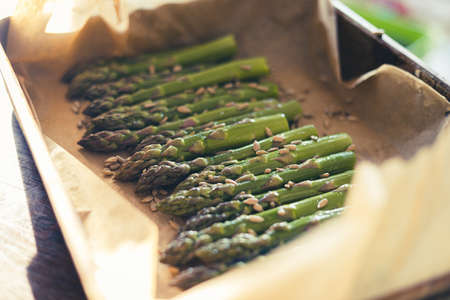 Grilled asparagus with sunflower seedsの写真素材
