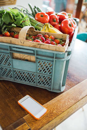 Home delivery grocery shopping online with smartphoneの写真素材