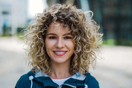 Portrait of young woman in the cityの写真素材