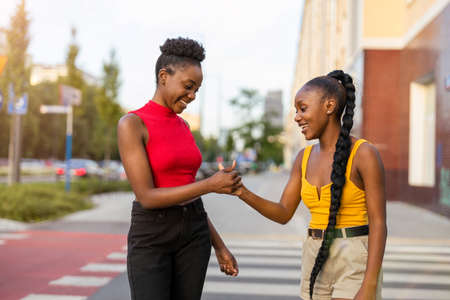 Two girlfriends having fun in the city