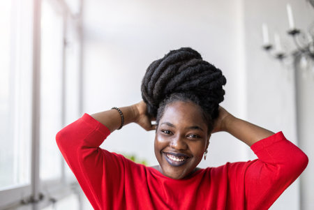 Portrait of a smiling young woman indoorsの写真素材