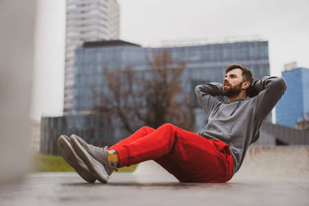 Young man exercising in urban settingの写真素材