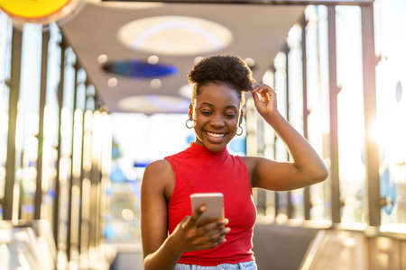 Young woman using mobile phone outdoors