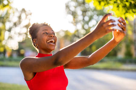 Young woman using mobile phone outdoors