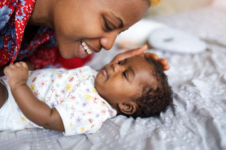 Mother with her newborn baby at home