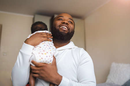 Father holding his newborn babyの写真素材