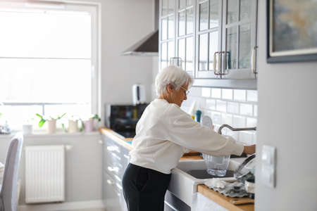 Shot of a senior woman in her kitchenの写真素材