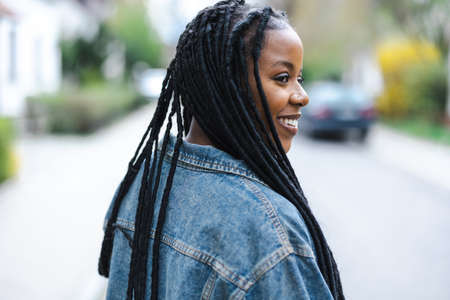 Portrait of a beautiful young woman in the cityの写真素材