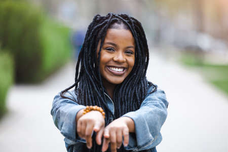 Portrait of a beautiful young woman in the cityの写真素材