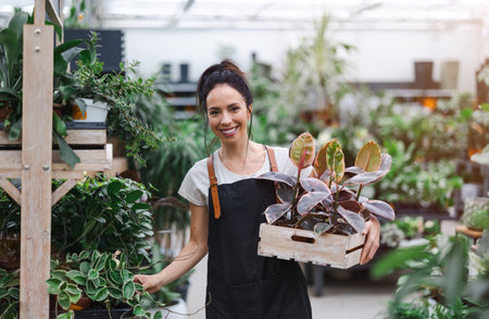 Woman working in a garden centerの写真素材