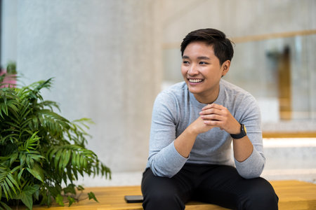 Portrait of a smiling young man in the officeの写真素材