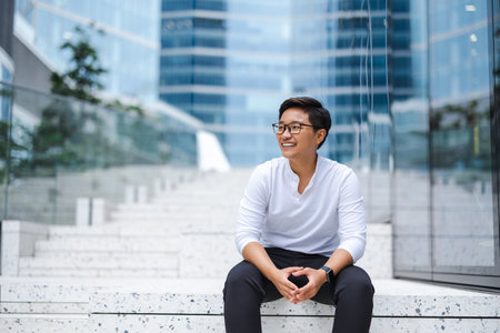 Portrait of a smiling young man in the cityの写真素材