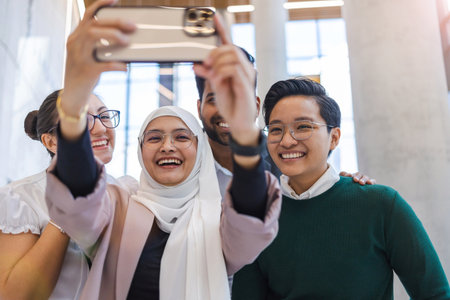 Multi-ethnic business group taking a self portrait in officeの写真素材
