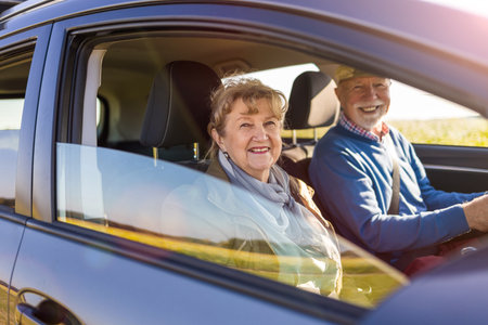 Senior couple driving a carの写真素材