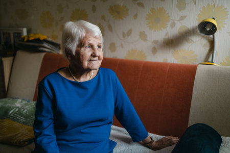 Portrait of an elderly woman in her homeの写真素材
