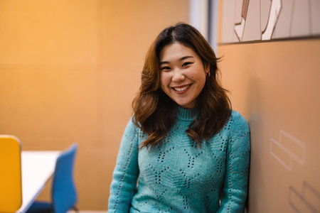 Portrait of a smiling asian businesswoman in officeの写真素材